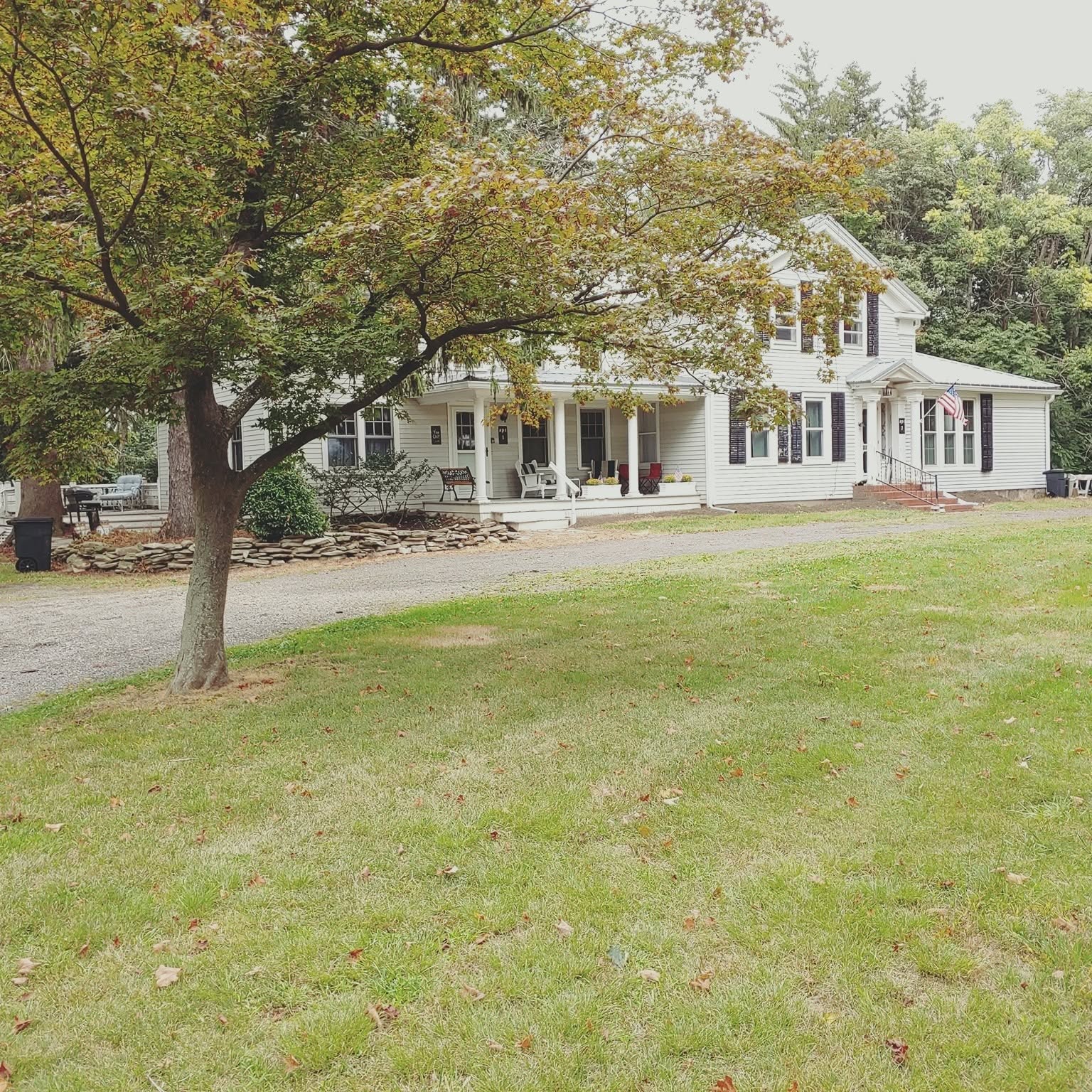 The historic white farmhouse at Vine Cliff today